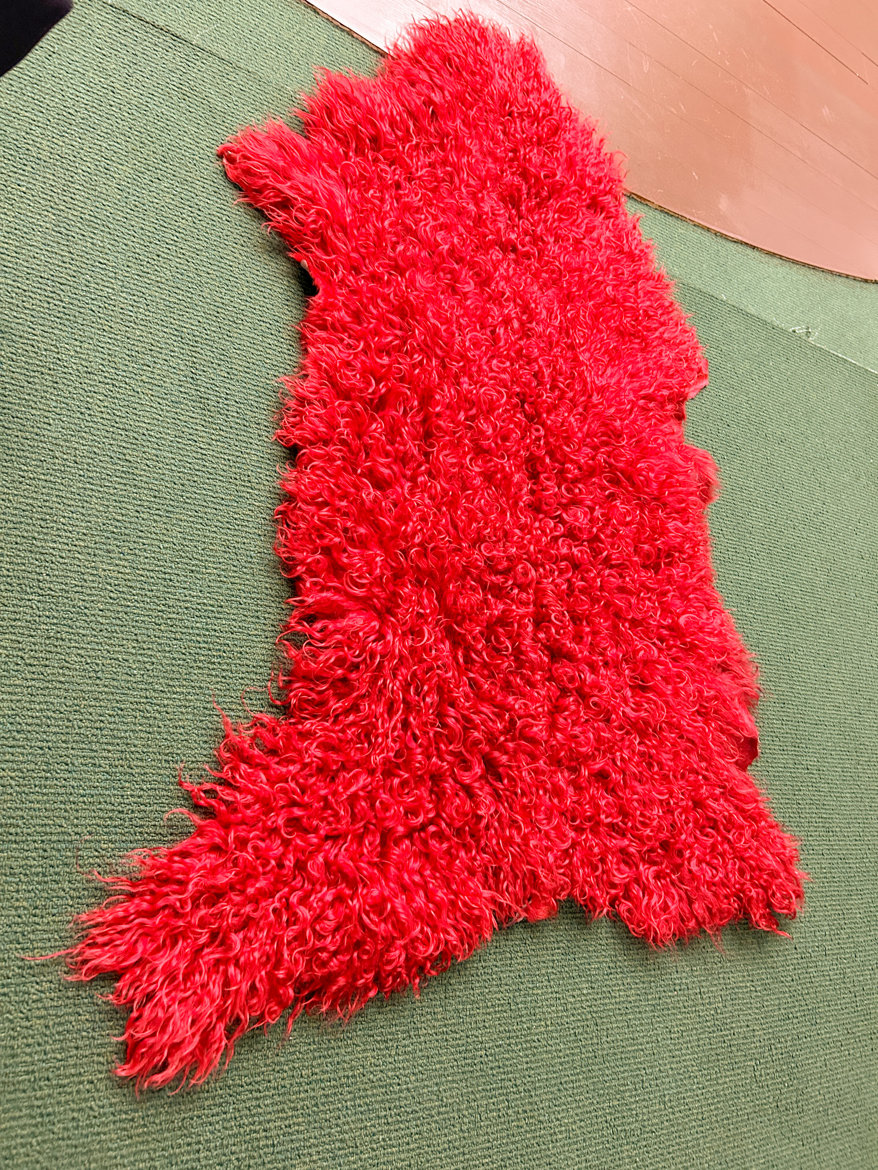 Red sheepskin rug