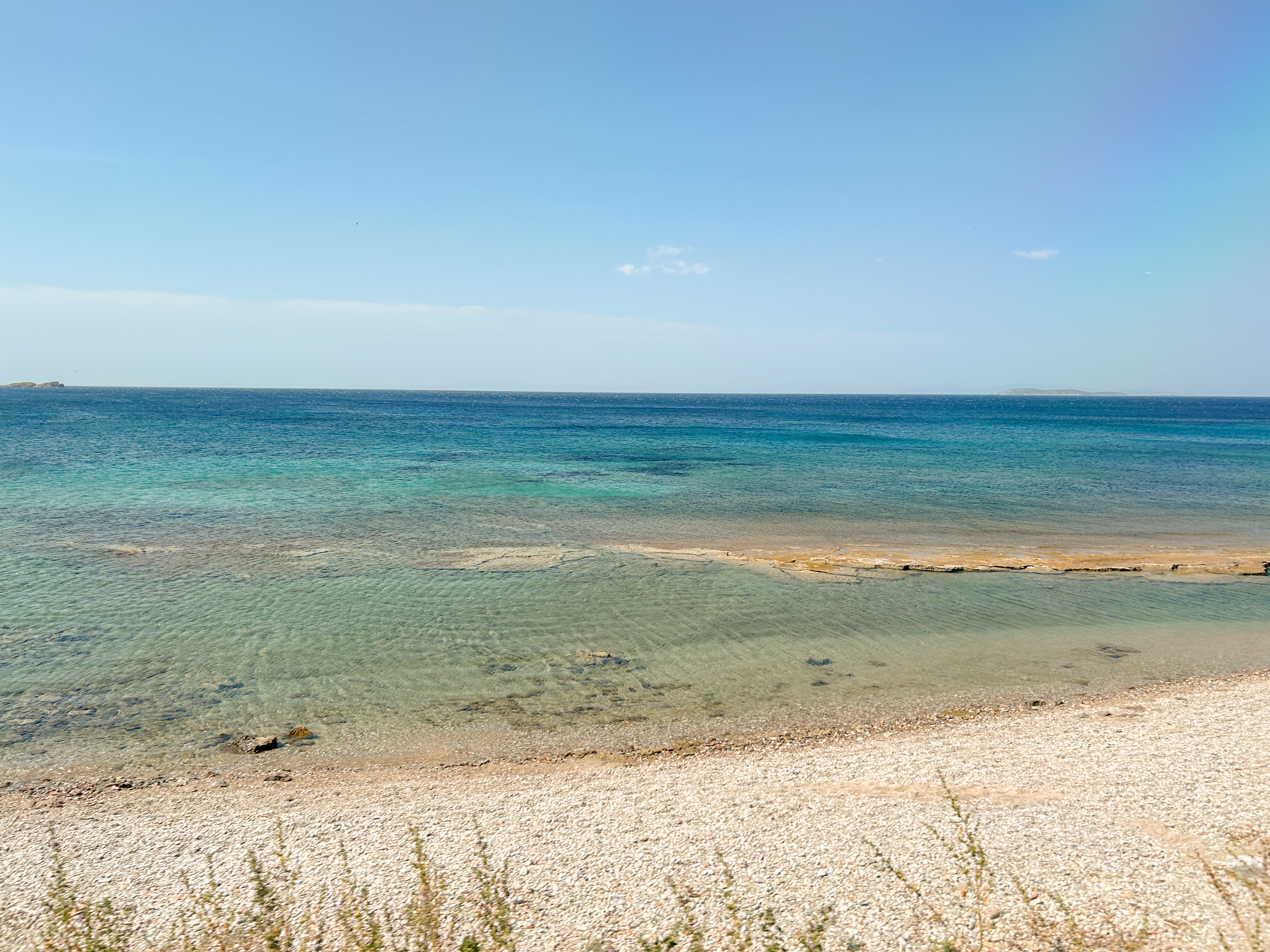Ocean view from the bus drive featuring a sandy beach.